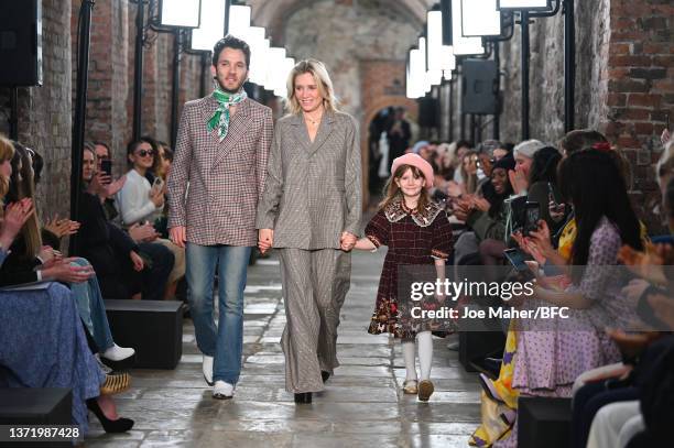 The Designers walk the runway with their child at the Paul and Joe show during London Fashion Week February 2022 on February 21, 2022 in London,...