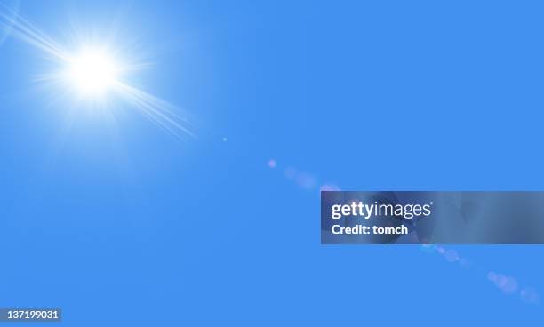 sun in the blue sky with lensflare - summer heat stock pictures, royalty-free photos & images