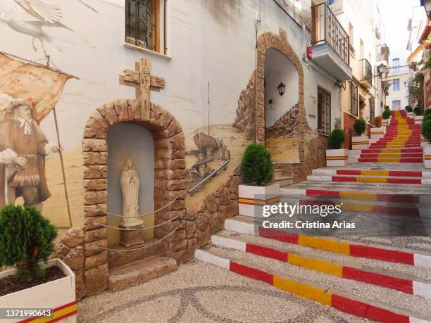 Puchalt street with the steps painted with the flag of Spain in the Old Town of Calpe on September 10, 2021 in Calpe, Alicante, Valencian Community,...