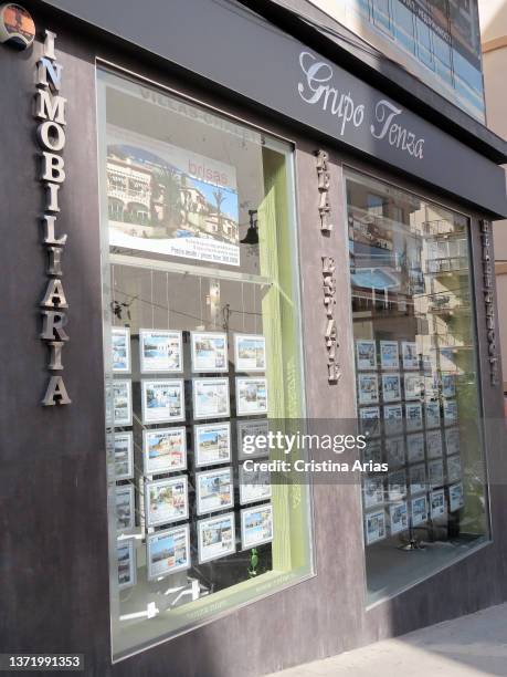 Announcements for the sale of apartments in the window of a real estate agency on september 10, 2021 in Calpe, Alicante, Valencian community, Spain.