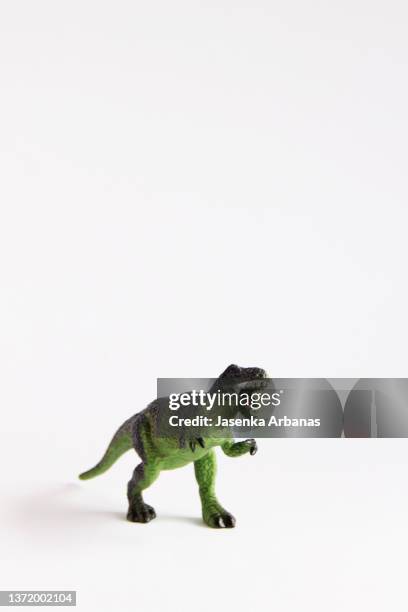 toy dinosaur on the white background - tyrannosaurus rex stock pictures, royalty-free photos & images