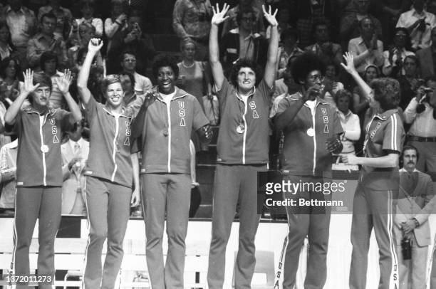 United States Olympic women's basketball team waves after they won the silver medal.