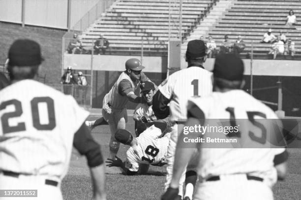 Sal Bando grabs ahold of Twins' Craig Nettles after Athletics Reggie Jackson charged the mound knocking down Twins pitcher Dick Woodson during the...