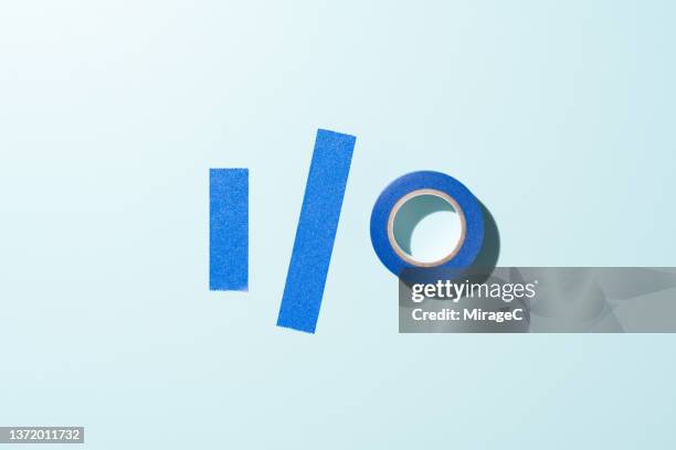 i/o input output symbol made of blue adhesive tape - masking tape stock pictures, royalty-free photos & images