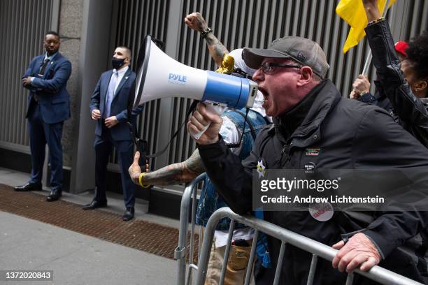 Small group of anti-vaccine mandate protestors scream for Governor Hochul to resign, outside of the New York State Democratic Party convention on...