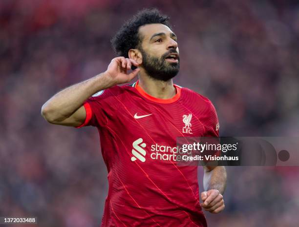 Mohamed Salah of Liverpool celebrates scoring his team's second goal and his one hundred and fiftieth for the club during the Premier League match...