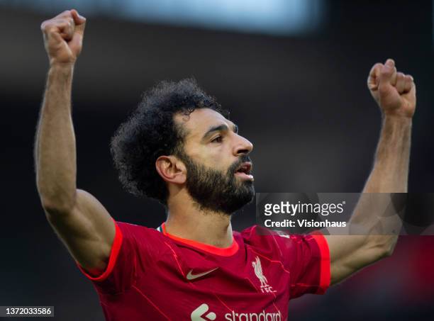 Mohamed Salah of Liverpool celebrates scoring his team's second goal and his one hundred and fiftieth for the club during the Premier League match...