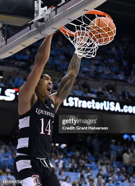 Dre Davis of the Louisville Cardinals dunks the ball against the North Carolina Tar Heels during the first half of their game at the Dean E. Smith...