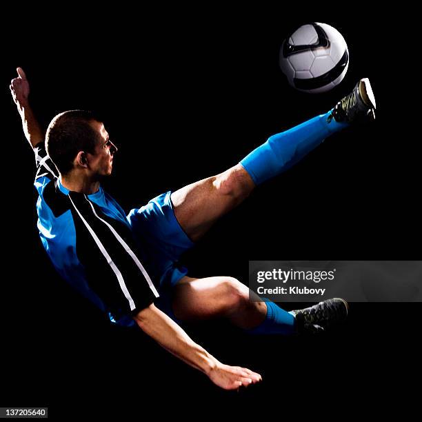 young caucasian male making soccer bicycle kick - bicycle kick stock pictures, royalty-free photos & images