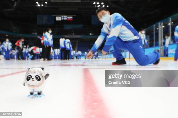 More than 2,000 volunteers pose for group photos after the Beijing 2022 Winter Olympic Games at National Indoor Stadium on February 21, 2022 in...