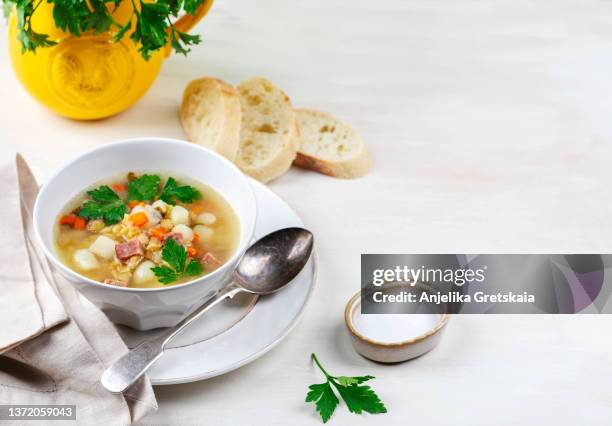 split pea soup with smoked ham. healthy homemade thick split soup in bowl. - ham and potato soup stock pictures, royalty-free photos & images