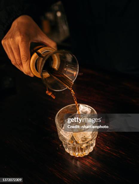 barista using chemex to make coffee - cocktail making stock pictures, royalty-free photos & images