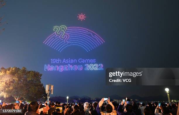 Over 1,000 illuminated drones display the pattern of the emblem of Hangzhou Asia Games in the night sky above the West Lake to welcome the 200-day...