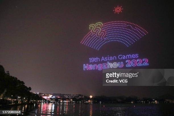 Over 1,000 illuminated drones display the pattern of the emblem of Hangzhou Asia Games in the night sky above the West Lake to welcome the 200-day...