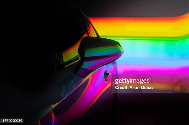 electric car illuminated with colorful lights while charging at home. - catalonia stock pictures, royalty-free photos & images