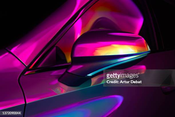 electric car illuminated with colorful lights. - futuristic cars foto e immagini stock