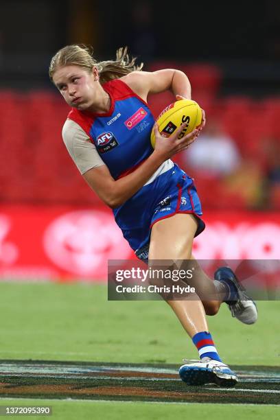 Isabella Grant of the Bulldogs runs the ball during the round three AFLW match between the Gold Coast Suns and the Western Bulldogs at Metricon...