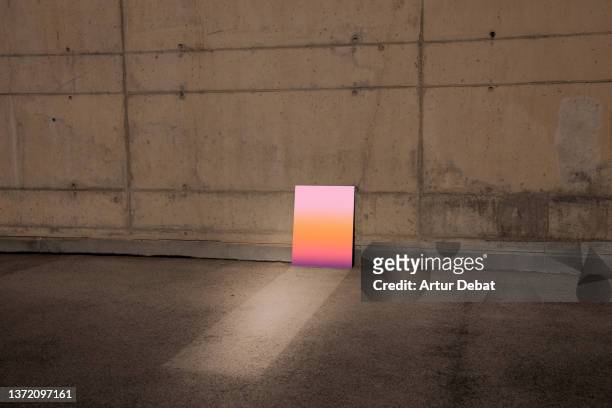 conceptual picture of a mirror reflecting sunset sky in minimal architecture. - great depression stock-fotos und bilder