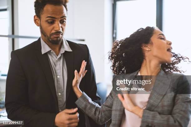 bad work environment - coworker conflict stock pictures, royalty-free photos & images