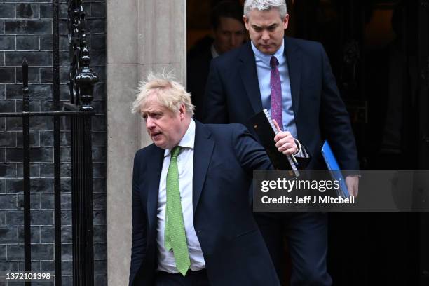 British Prime Minister Boris Johnson and Downing Street Chief of Staff Steve Barclay leave 10 Downing Street at Downing Street on February 22, 2022...