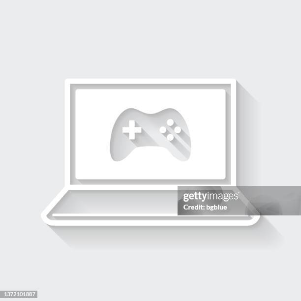 video game on laptop. icon with long shadow on blank background - flat design - gaming controller white stock illustrations