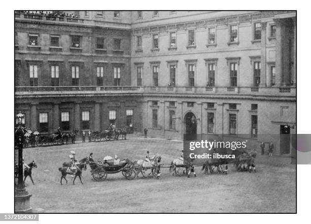 antique london's photographs: royal procession leaving the quadrangle, buckingham palace - buckingham palace exterior stock illustrations