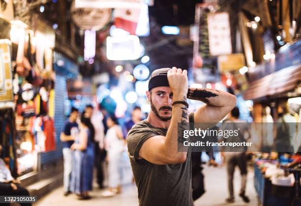 serious pensive man standing in kathmandu - cool guy in hat stock pictures, royalty-free photos & images