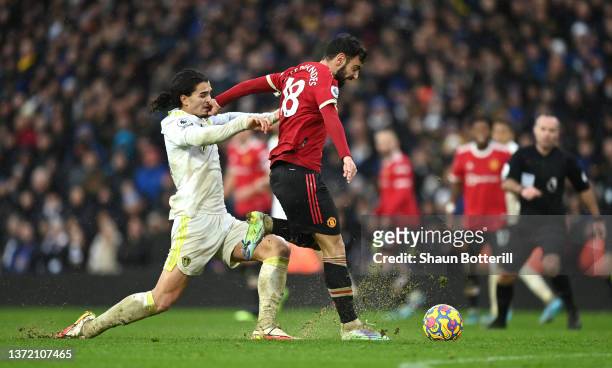 Bruno Fernandes of Manchester United is challenged by Pascal Struijk of Leeds United during the Premier League match between Leeds United and...