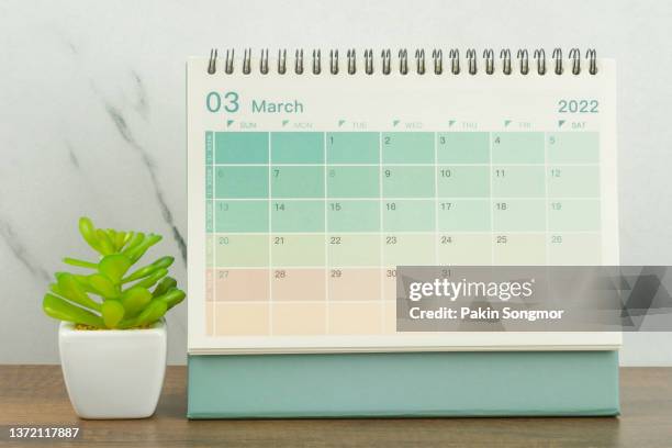 calendar desk 2022 march is the month for the organizer to plan and remind on the wooden table background. - march month bildbanksfoton och bilder