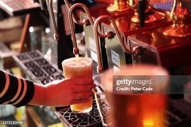 pint of draught beer being poured - ale stock pictures, royalty-free photos & images