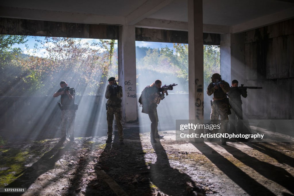 Military swat team members during operation.