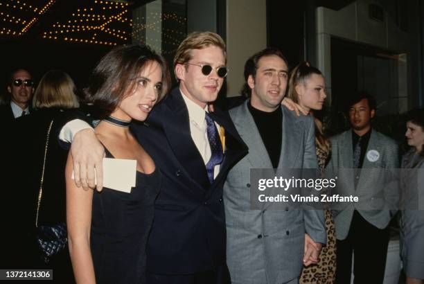 Actor Cary Elwes and wife Lisa Marie Kurbikoff and actor Nicolas Cage and girlfriend Kristen Zang attend an event, US, circa 1993.