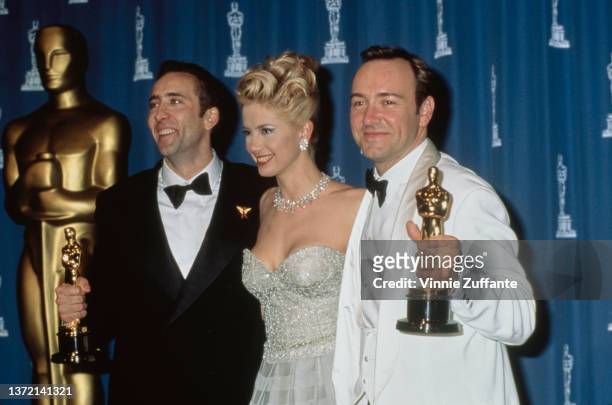 Oscar winners actors Kevin Spacey, Mira Sorvino and Nicolas Cage backstage during the 68th Academy Awards in Los Angeles, California, March 25th 1996.