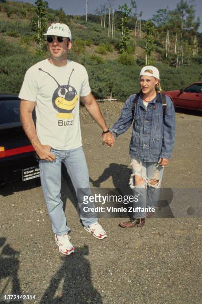Actress Patricia Arquette and actor Nicolas Cage attend the Pediatric Aids Foundation 'Hero' Fundraiser, US, circa 1996.