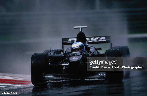 Mika Salo of Finland drives the Danka Zepter Arrows Arrows A19 Arrows V10 in the rain during practice for the Formula One Italian Grand Prix on 12th...
