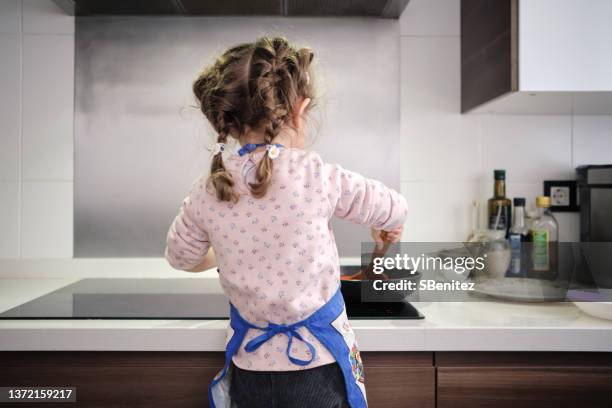 little girl making food - children only braided ponytail stock pictures, royalty-free photos & images