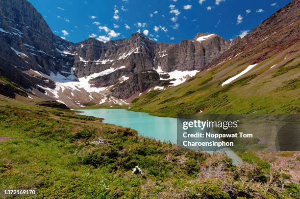 scenic view of cracker lake and mount siyeh - glacier national park - montana - usa - idyllwild snow stock pictures, royalty-free photos & images