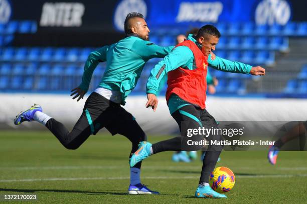 Alexis Sanchez and Arturo Vidal of FC Internazionale in action during the FC Internazionale training session at the club's training ground Suning...