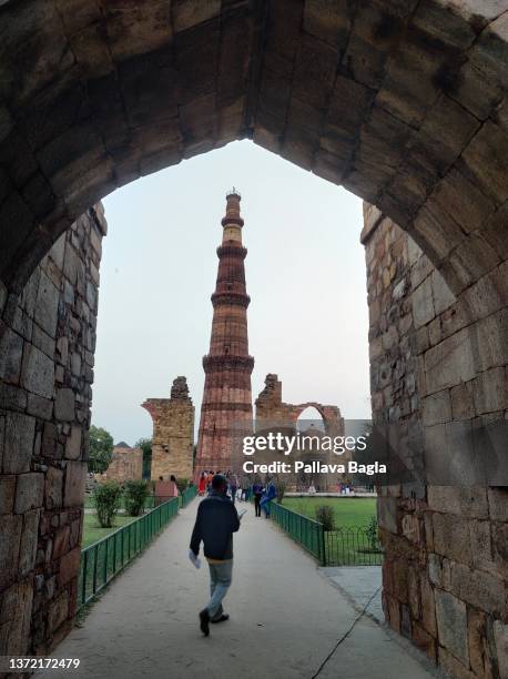 Views of the Qutab Minar the massive Victory Tower, the one thousand year old minaret, a public monument in the heart of New Delhi. Seen on February...