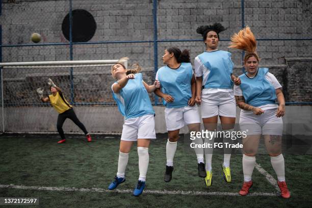 scoring a goal on a free kick during soccer match - woman goalie stock pictures, royalty-free photos & images