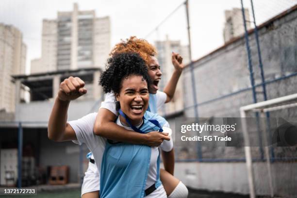 female soccer players celebrating a goal - sportsman stock pictures, royalty-free photos & images