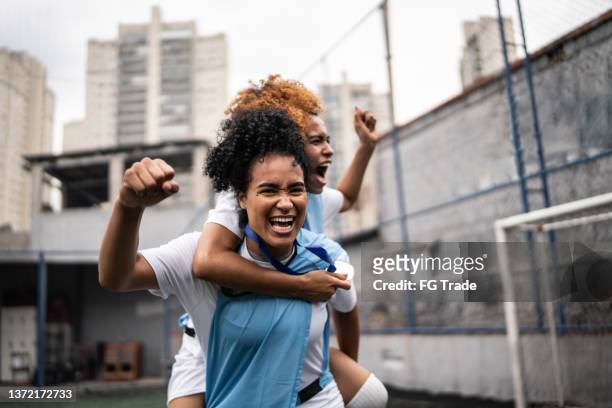 female soccer players celebrating a goal - brazil football bildbanksfoton och bilder