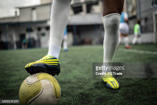 low section of female soccer game - soccer boot stock pictures, royalty-free photos & images
