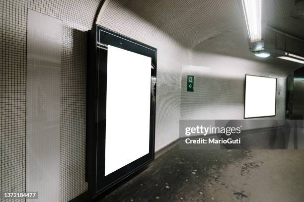 blank billboards in a subway station corridor - subway station poster stock pictures, royalty-free photos & images