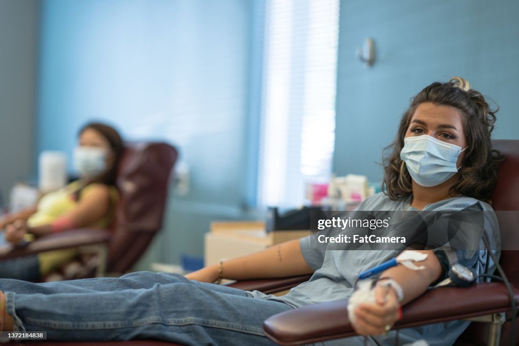 Young Woman Donating Blood at a Clinic