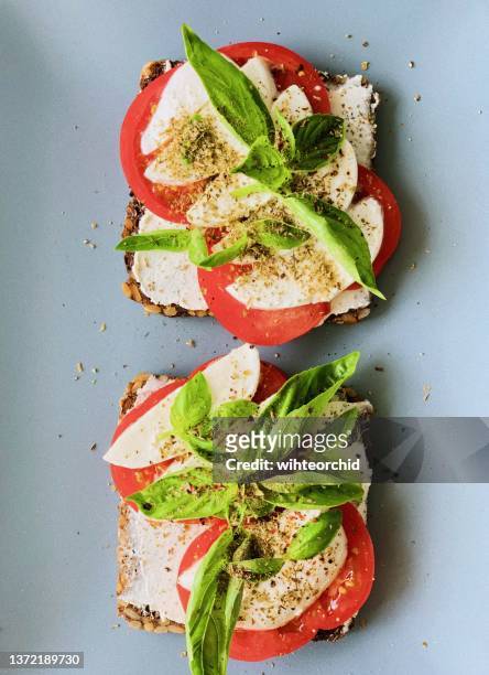 cream cheese toast with tomato and mozzarella - ciabatta stock pictures, royalty-free photos & images
