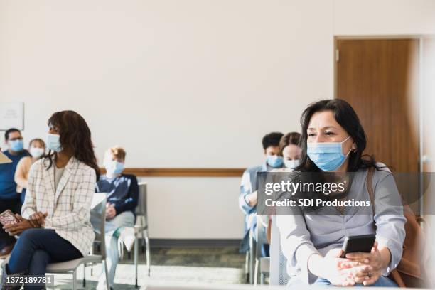 the waiting room of adults at a local hospital - hospital waiting room stockfoto's en -beelden