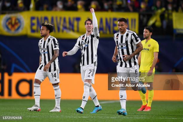 Dusan Vlahovic of Juventus celebrates after scoring their team's first goal during the UEFA Champions League Round Of Sixteen Leg One match between...