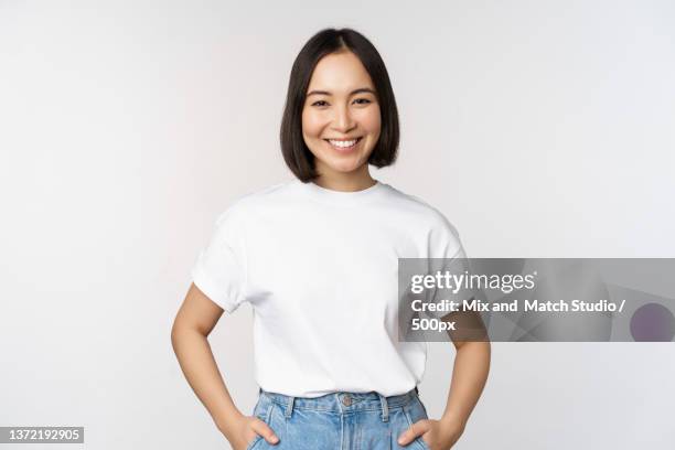 lifestyle happy modern asian girl,smiling and looking happy at - one woman only t-shirt stock pictures, royalty-free photos & images