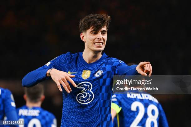 Kai Havertz of Chelsea celebrates with teammates after scoring their team's first goal during the UEFA Champions League Round Of Sixteen Leg One...